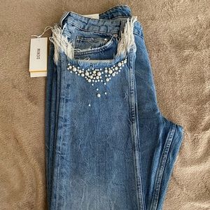 Distressed denim pearl jeans